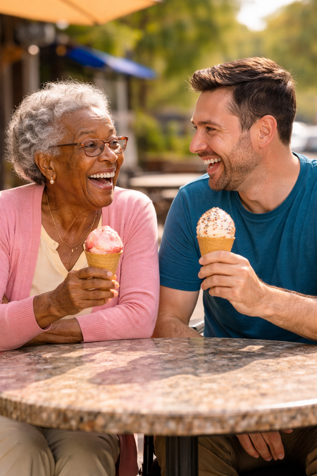 Two people sharing a joyful ice cream moment